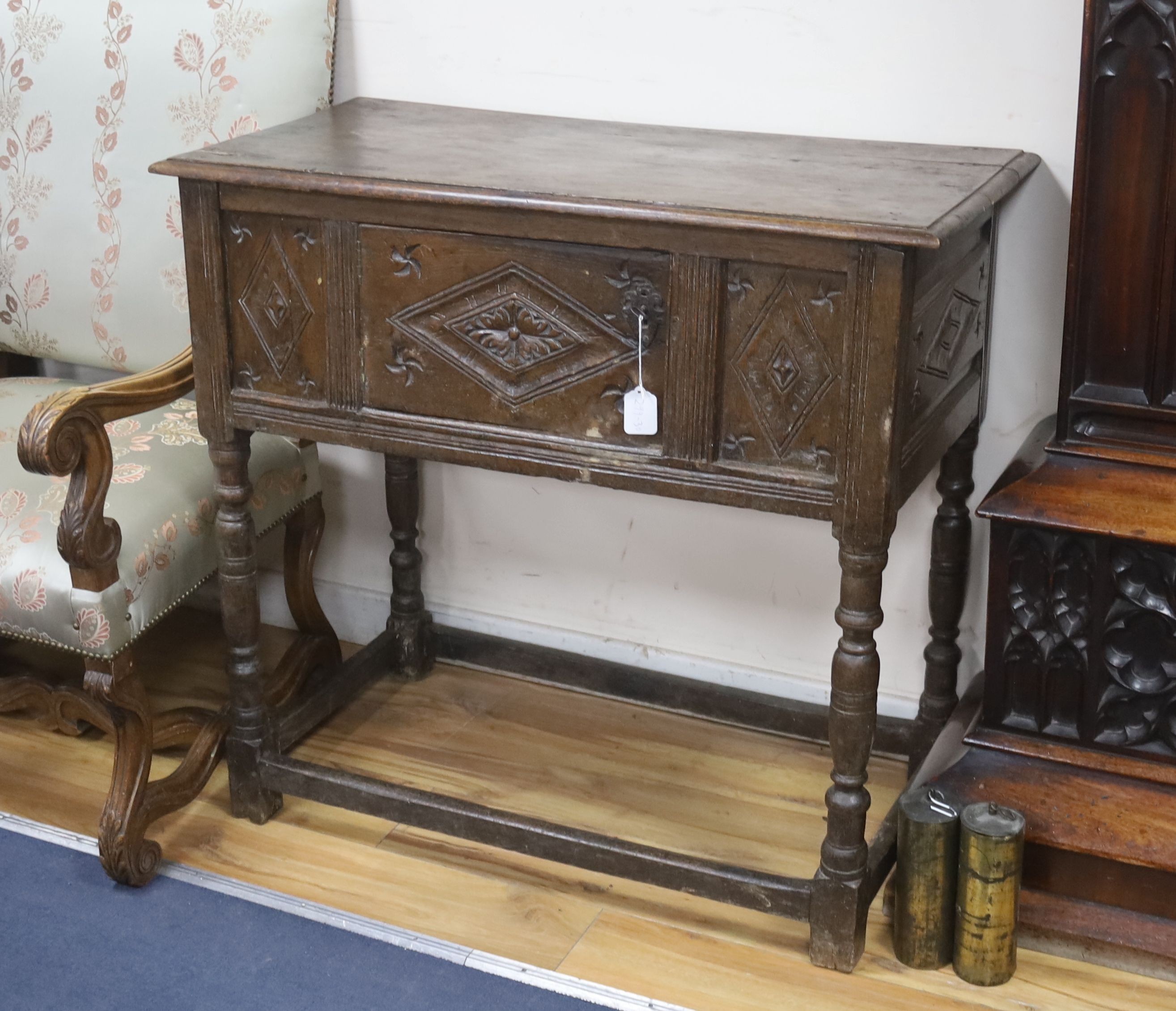 A 17th century panelled oak side cupboard, length 97cm, depth 48cm, height 91cm